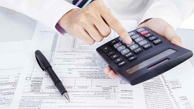calculator pen and tax return